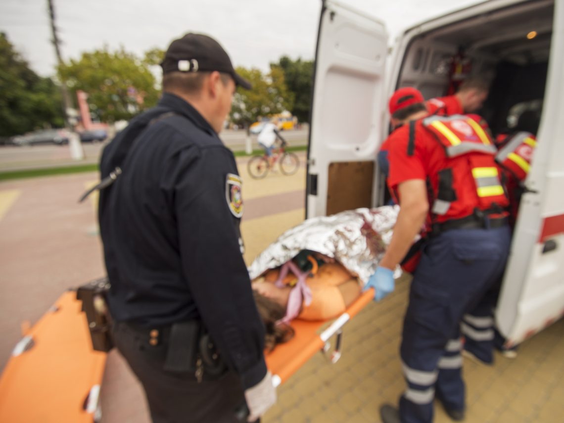 paramedics loading up someone in ambulance